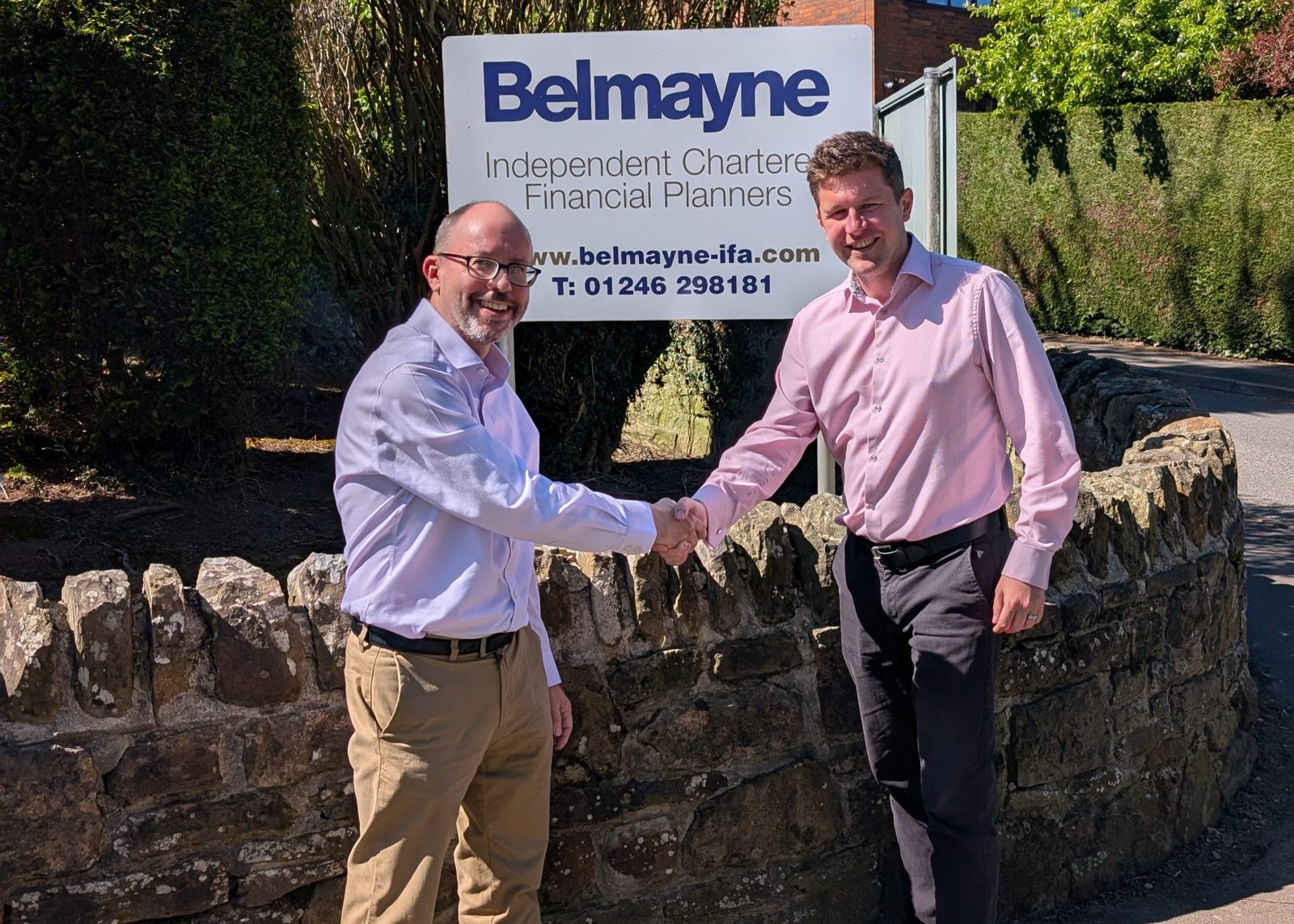 Matt Spivey, left, is welcomed to Belmayne by chartered financial planner Alex Napier, right
