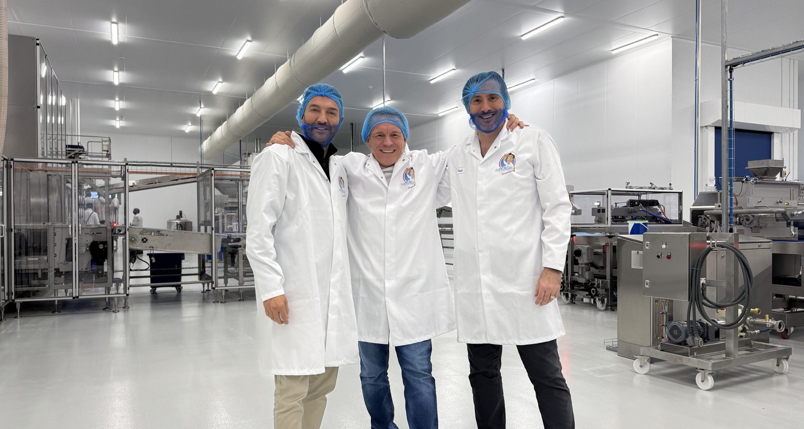 Mr Whippy chief executive Michael Corrado Jackson, chairman Scott Fletcher and strategic development director Joe Sealey, left to right, in white coats and hairnets on the new production floor