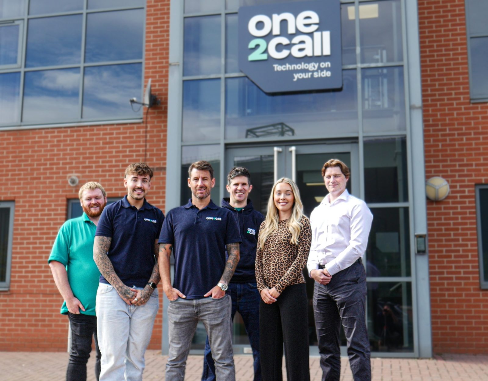 Ryan Howden, Lewis Watson, managing director Nick Bass, Andrew Marsh, Rebecca Masters and Gabriel Williams, left to right, outside One2Call's office